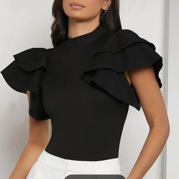 Gorgeous black knit bodysuit with layers of fabric pieces for sleeves. Snap clos - Picture 2 of 4